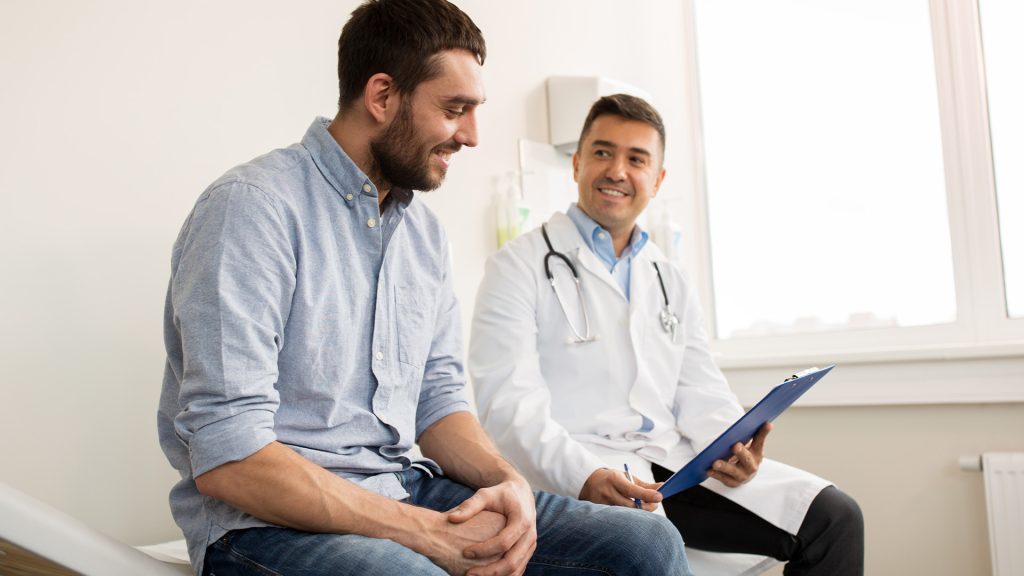 Man meets with his doctor