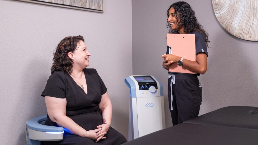 emsella-florida-center-for-hormones-and-wellness A patient is seated on the BTL Emsella