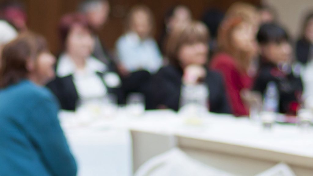 Group of people at a meeting.