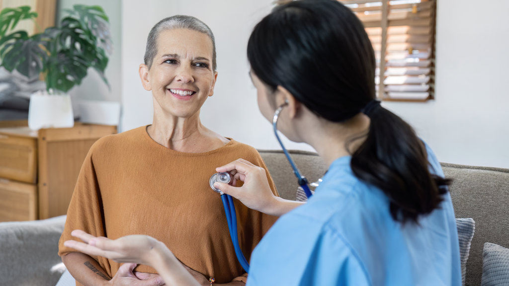 female-patient Doctor examining patient with stethoscope.